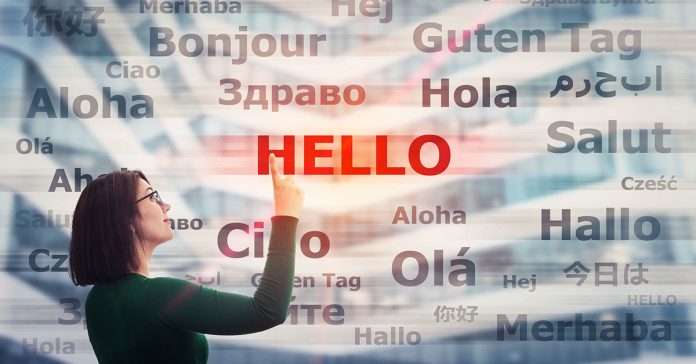 Woman next to foreign words on a screen