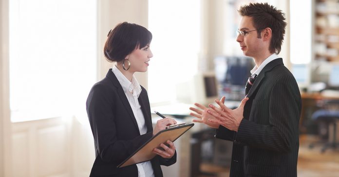 Two business people in discussion, language learning can boost your career