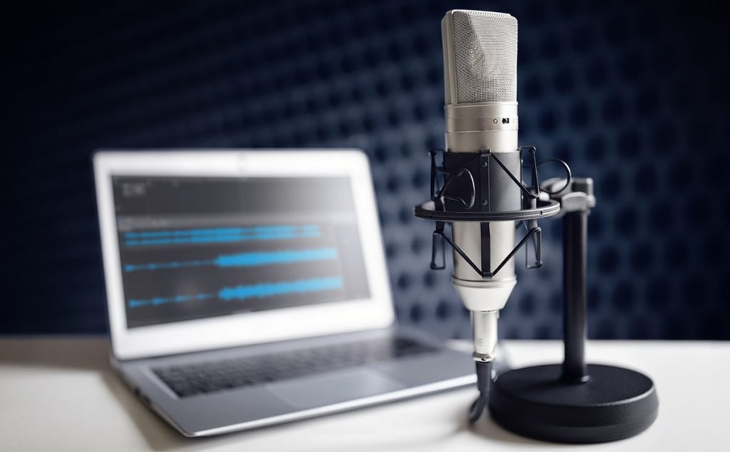 Podcasting Microphone in Front of a Laptop Computer