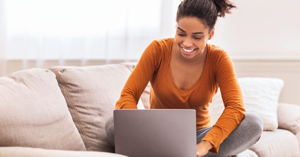 Woman learning a language sitting on the sofa