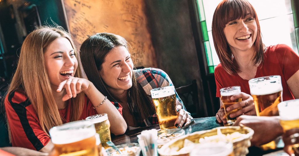 People in a bar make friends and learn a new language